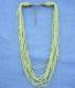 COLLANA PERLINE 9 FILI.COLORE VERDE CHIARO.
