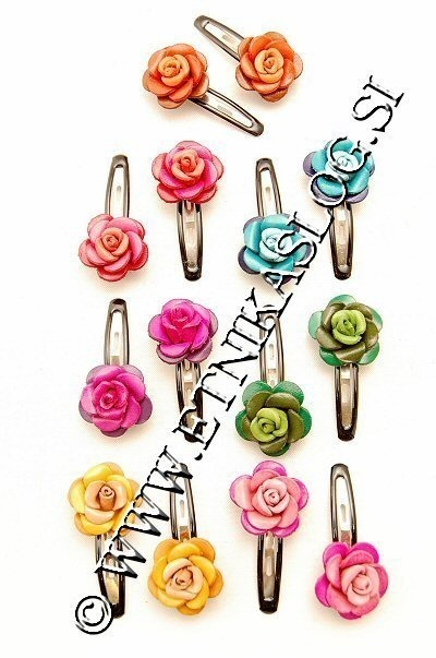FERMACAPELLI IN CUOIO, MOTIVO FIORE, DISPONIBILE I FERMACAPELLI IN CUOIO, MOTIVO FIORE, DISPONIBILE I